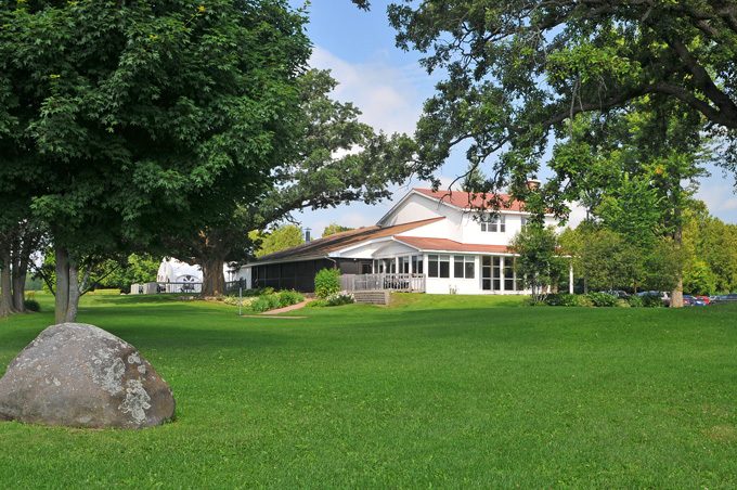 grass area with clubhouse in background